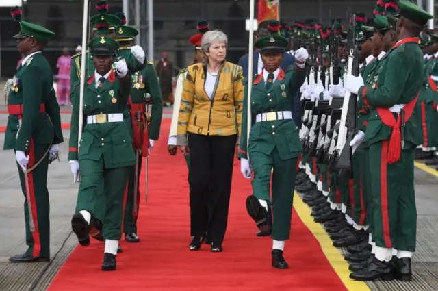 Theresa May inspects guard of honour