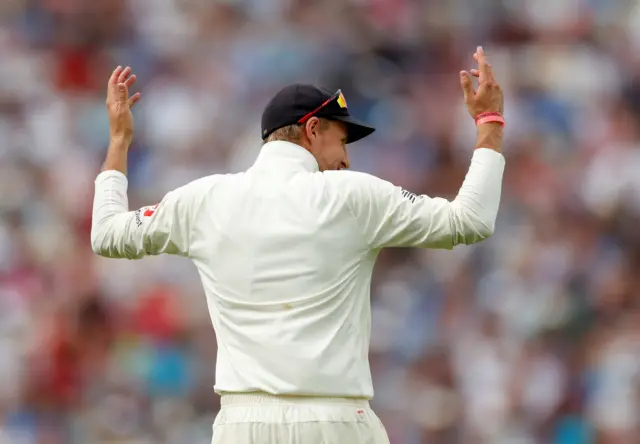 Joe Root gestures to the crowd