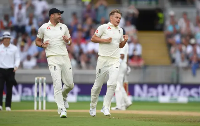 Sam Curran (r) celebrates with James Anderson after taking the wicket of Ajinkya Rahane