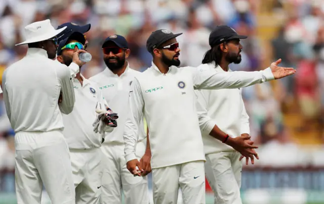 Virat Kohli reacts after a decision is overturned following a referral