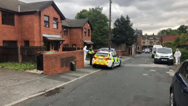 Police outside the house in Chapeltown