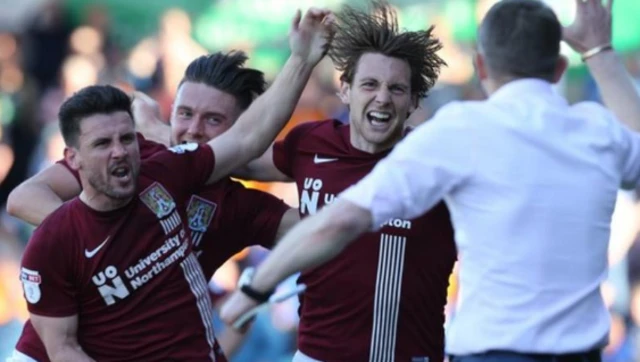 Northampton Town footballers celebrate a goal scored against Oldham Athletic on 5 May 2018