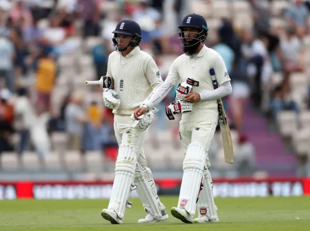 Moeen Ali and Sam Curran walk off