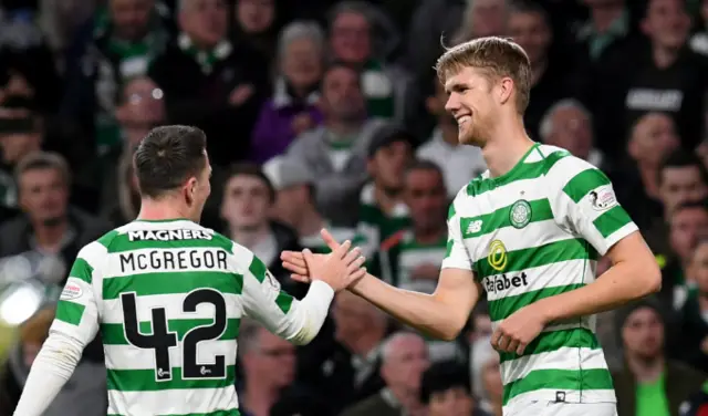 Kristoffer Ajer is congratulated by Callum McGregor