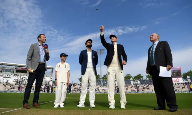 England captain Joe Root tosses the coin alongside India captain Virat Kohli