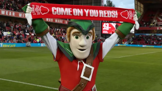 Nottingham Forest mascot holding up a scarf