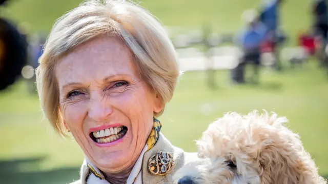 Mary Berry holding a dog