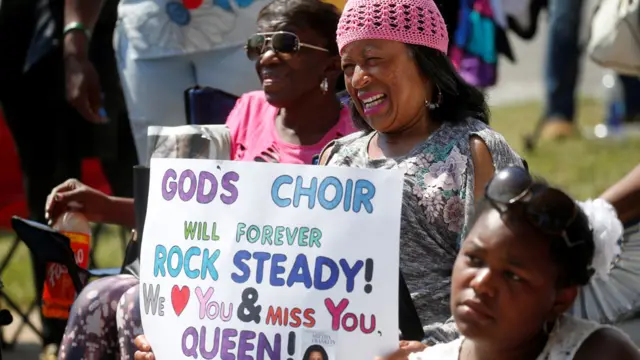 Mourners outside the service