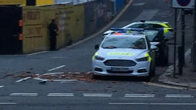 A police car surrounded by tiles