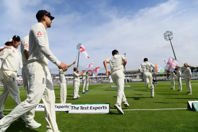 The England team make their way onto the field before day 4