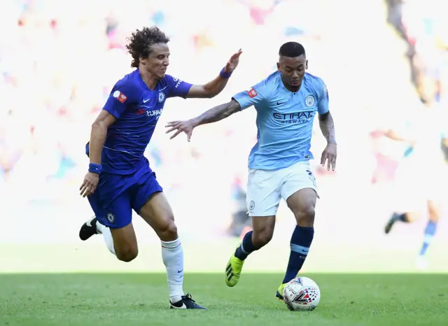 Gabriel Jesus of Manchester City holds off David Luiz of Chelsea