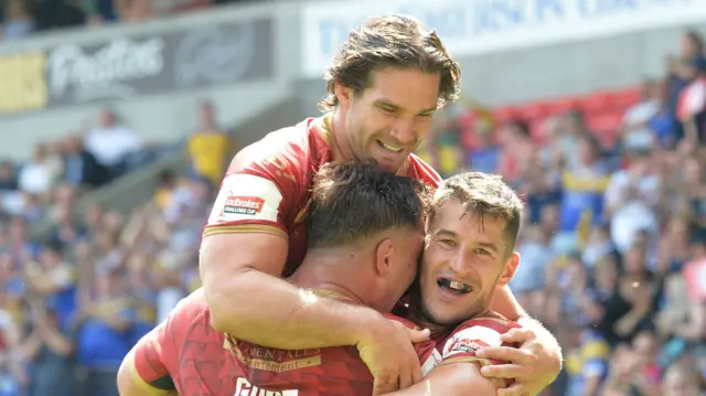 Catalans Dragons players celebrate