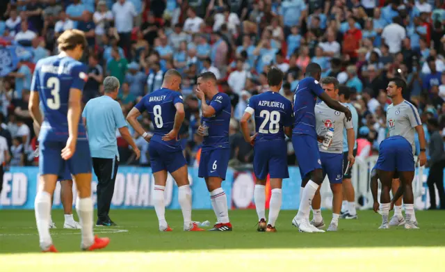 Chelsea's Danny Drinkwater talks to Ross Barkley on the pitch at the end of the match