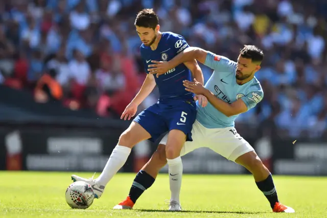 Jorginho (L) vies with Manchester City"s Argentinian striker Sergio Aguero