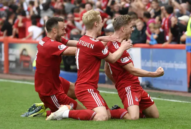 Aberdeen celebrate the equaliser from Bruce Anderson (right)