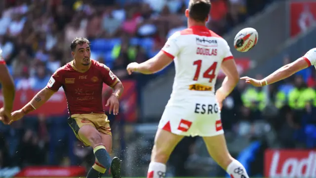 Catalans Dragons' Tony Gigot scores a drop-goal