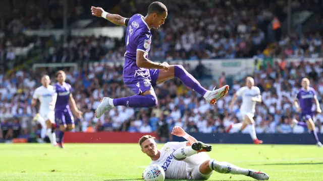 Barry Douglas wins a goal kick off Tom Ince