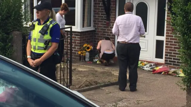 Sister reading messages outside Samantha Eastwood's home