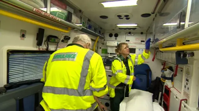 Two paramedics in an ambulance.