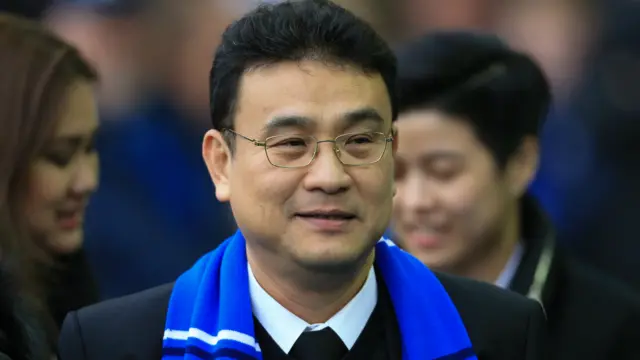 Dejphon Chansiri wearing a blue scarf