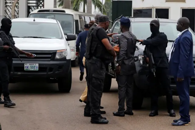 Members of security forces block the entrance of the National Assembly in Abuja, Nigeria August 7, 2018