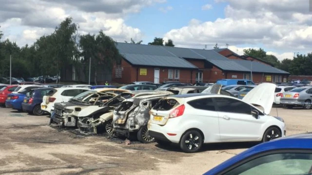 Burnt out cars at HMP Birmingham
