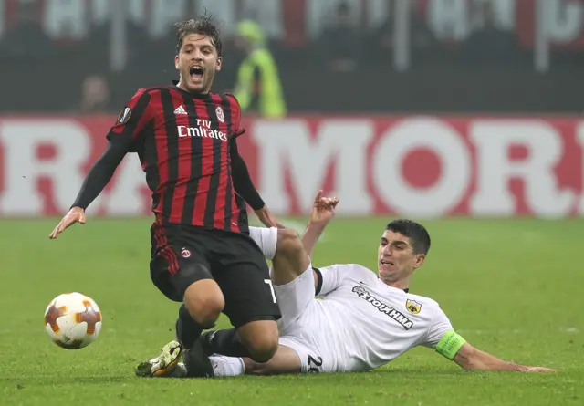 Manuel Locatelli of AC Milan clashes with Petros Mantalos of AEK Athens in their Europa League group clash last season