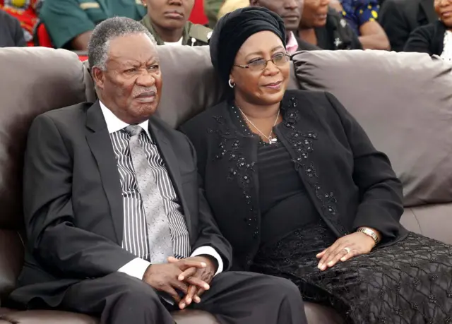 Michael Sata (L) and his wife, Dr Christine Kaseba, attend the the burial on February 11, 2013 at Mutengo Cemetery in Ndola, of the Chibombo accident victims