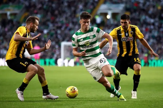 Celtic's Kieran Tierney takes on Tasos Bakasetas of AEK Athens