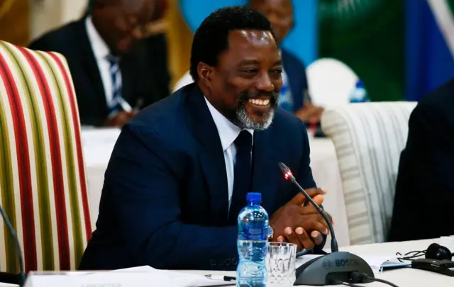 President of the Democratic Republic of Congo Joseph Kabila smiles as he delivers his remarks during a meeting with South African President Jacob Zuma at Sefako Makgatho Presidential Guest House in Pretoria on June 25, 2017