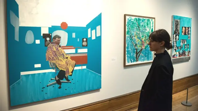 Pictures at Ferens Art Gallery, one showing a man in a barbers chair.