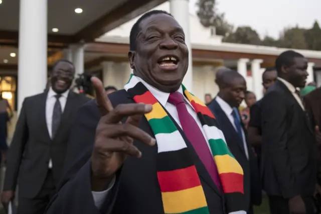 President-elect Emmerson Mnangagwa steps onto the lawn to pose for photographs after attending a press conference on August 3, 2018 in Harare, Zimbabwe. Zimbabwe Electoral Commission (ZEC) officials last night announced the re-election of President Emmerson Mnangagwa of the ruling Zimbabwe African National Union - Patriotic Front (ZANU-PF).