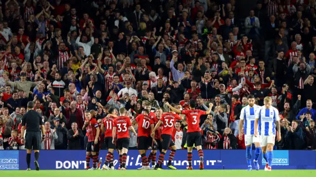 Southampton celebrate a late winner against Brighton