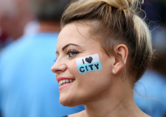 Man city fan with an I love city tattoo