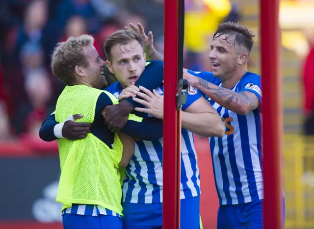 Greg Stewart (centre) celebrates his goal