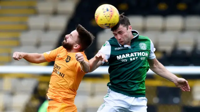 Livingston's Steven Lawless (left) and Hibs' Lewis Stevenson challenge for the ball.