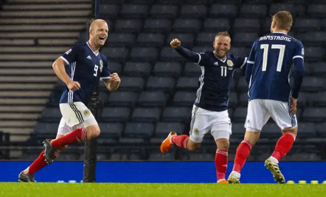 Steven Naismith (left) celebrates scoring Scotland's second goal