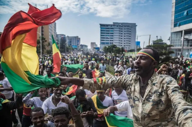 Ethiopians wave national flags and celebrate in the streets of Addis Ababa the return of Berhanu Nega, the leader of the former armed movement Ginbot 7, after 11 years in exile, on September 9, 2018.