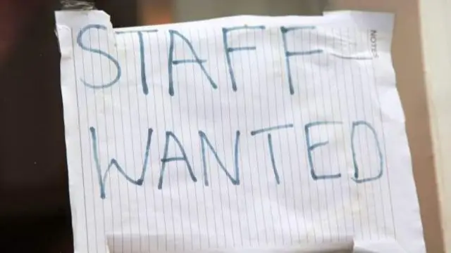 A staff wanted sign