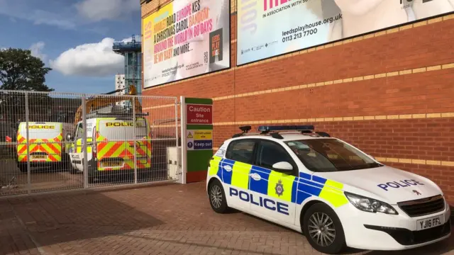 The police cars outside West Yorkshire Playhouse