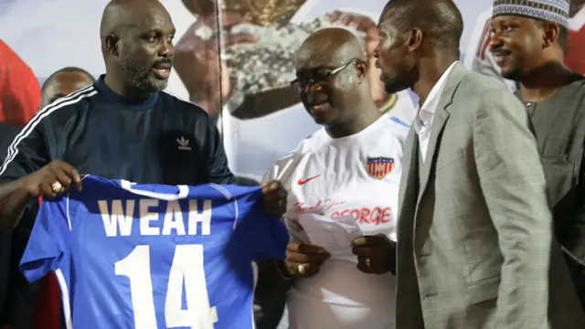 Weah being presented with the number 14 shirt