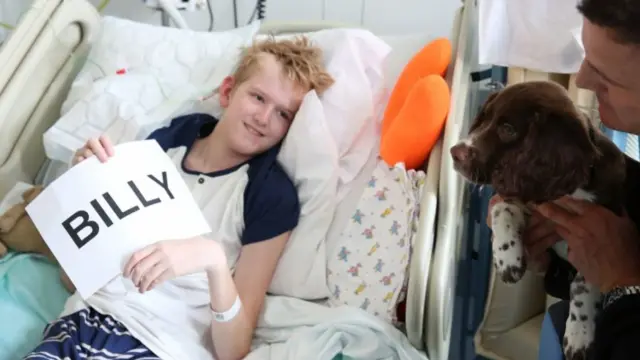 Billy with child in hospital