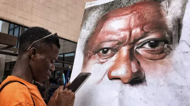 An artist painting Kofi Annan in Accra, Ghana