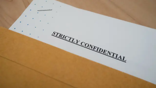 A document that reads: Strictly confidential