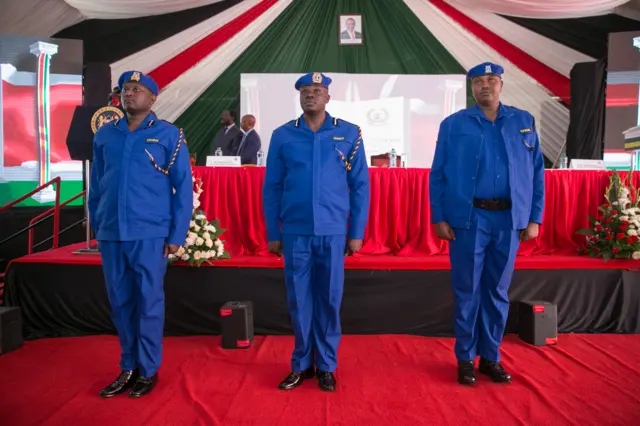 Three policemen lining up