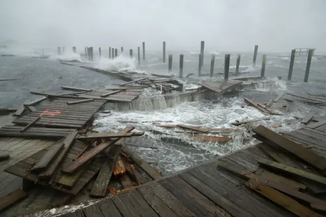 Destroyed boardwalk in waves