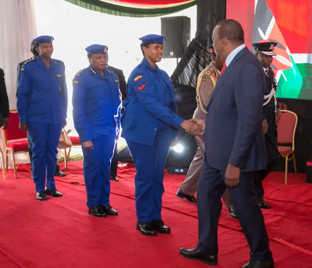 Policemen meeting President Kenyatta