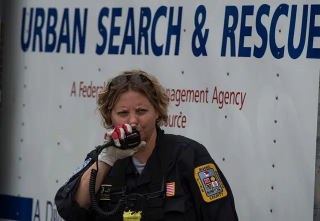 A Fema member prepares for the storm's arrival