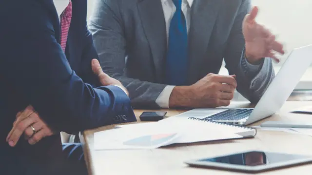 Two men in a meeting