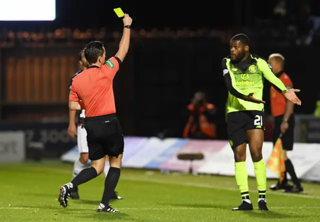 Andrew Dallas shows Olivier Ntcham a second yellow card